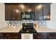 Close up of the kitchen appliances and backsplash at 443 Hermosa St, Brighton, CO 80603
