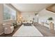 Inviting living area with large window, neutral colors and comfortable seating arrangement at 443 Hermosa St, Brighton, CO 80603