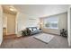 Cozy living room with neutral walls, a plush rug, and a comfortable sofa at 443 Hermosa St, Brighton, CO 80603