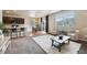 Open-concept living area seamlessly blending the living room, dining space, and kitchen at 443 Hermosa St, Brighton, CO 80603