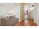 View into the office with a desk and view of the kitchen at 443 Hermosa St, Brighton, CO 80603