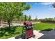 Patio with grill and yard, perfect for outdoor entertaining at 3563 Watada Dr, Brighton, CO 80601