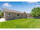 Large, green backyard with well-maintained lawn at 3563 Watada Dr, Brighton, CO 80601