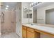Accessible bathroom featuring a roll-under sink, accessible shower with bars and tiled flooring at 3563 Watada Dr, Brighton, CO 80601