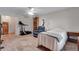 Cozy bedroom with carpet, ceiling fan, and fitness equipment adds convenience to comfort at 3563 Watada Dr, Brighton, CO 80601