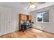 Bedroom with hardwood floors, desk and ceiling fan at 3563 Watada Dr, Brighton, CO 80601