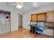 Bedroom featuring hardwood floors, built-in desk and storage at 3563 Watada Dr, Brighton, CO 80601