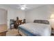 This bedroom offers a double door closet, ceiling fan, and workspace at 3563 Watada Dr, Brighton, CO 80601