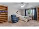 Bedroom with ample natural light, bookcase, and ceiling fan at 3563 Watada Dr, Brighton, CO 80601
