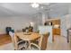 Sunny dining area with backyard views and an open floorplan layout at 3563 Watada Dr, Brighton, CO 80601