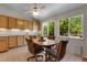 Cozy dining nook with bright windows, cabinets, and natural light at 3563 Watada Dr, Brighton, CO 80601