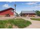 Exterior building view with crosswalk and manicured landscaping at 3563 Watada Dr, Brighton, CO 80601