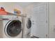 Bright laundry room featuring modern washer and dryer at 3563 Watada Dr, Brighton, CO 80601