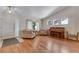 Inviting living room featuring hardwood floors, bright windows, and vaulted ceilings at 3563 Watada Dr, Brighton, CO 80601