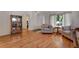 Cozy living room showcasing hardwood floors, comfortable seating, and a welcoming ambiance at 3563 Watada Dr, Brighton, CO 80601