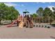 Community playground featuring multiple play structures and swings at 3563 Watada Dr, Brighton, CO 80601