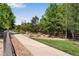 Community walking path surrounded by lush landscaping at 3563 Watada Dr, Brighton, CO 80601