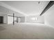 Spacious unfinished basement with white walls, neutral carpet, and natural light from window at 5031 Moss Pl, Golden, CO 80403