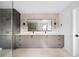 Elegant bathroom featuring a double vanity with modern cabinetry, a large mirror, and stylish lighting at 5031 Moss Pl, Golden, CO 80403