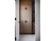 Bathroom featuring light wood cabinets with black hardware, offering ample storage space at 5031 Moss Pl, Golden, CO 80403