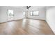 Bright bedroom with hardwood floors, large windows, and a ceiling fan, offering comfort and style at 5031 Moss Pl, Golden, CO 80403