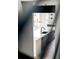 Modern kitchen featuring sleek white countertops, gray cabinets, and stylish pendant lighting at 5031 Moss Pl, Golden, CO 80403