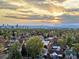 Stunning aerial view of the city skyline at sunset with beautiful trees in the foreground at 3401 N Steele St, Denver, CO 80205