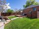Spacious backyard with a wooden deck, perfect for outdoor entertaining at 3401 N Steele St, Denver, CO 80205