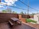 Backyard deck with wooden picnic table and seating area providing a relaxing outdoor space for gatherings and dining at 3401 N Steele St, Denver, CO 80205