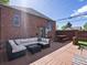 A wooden backyard deck with an outdoor seating area perfect for relaxing or entertaining guests at 3401 N Steele St, Denver, CO 80205