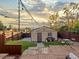 Charming backyard featuring a shed, patio, BBQ, and a well-maintained lawn with a wooden fence at 3401 N Steele St, Denver, CO 80205