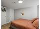 Comfortable bedroom featuring neutral tones and a star decoration at 3401 N Steele St, Denver, CO 80205