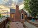 Charming brick home exterior showcasing unique architectural details, landscaped front yard, and inviting entrance at 3401 N Steele St, Denver, CO 80205
