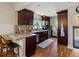 Modern kitchen with granite countertops, stainless steel appliances, and sleek wooden cabinets at 3401 N Steele St, Denver, CO 80205