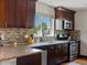 Close up of modern kitchen with stone countertops and stainless steel appliances at 3401 N Steele St, Denver, CO 80205