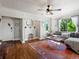 Bright living room featuring hardwood floors, a decorative fireplace, and a comfortable seating area at 3401 N Steele St, Denver, CO 80205