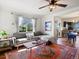Cozy living room with hardwood floors, comfortable seating, and an open view to the dining and kitchen areas at 3401 N Steele St, Denver, CO 80205