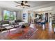 Inviting living room with hardwood floors, comfortable seating, and an open layout to the dining area at 3401 N Steele St, Denver, CO 80205