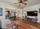 Bright living room with hardwood floors, stylish furniture, and an open view to the dining area at 3401 N Steele St, Denver, CO 80205