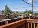 Picturesque view of the city skyline and mountains from a backyard at 3401 N Steele St, Denver, CO 80205