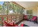 Inviting screened-in balcony with comfortable seating and a peaceful outdoor atmosphere at 3164 S Wheeling Way # 302, Aurora, CO 80014