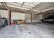 Spacious garage with ample storage, featuring multiple vehicles and equipment, perfect for organization at 3164 S Wheeling Way # 302, Aurora, CO 80014