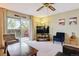 Bright living room with an open balcony, comfortable seating, and a modern entertainment setup at 3164 S Wheeling Way # 302, Aurora, CO 80014