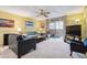 Cozy living room features a sliding glass door to a screened patio and bright, natural light at 3164 S Wheeling Way # 302, Aurora, CO 80014