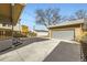 Expansive backyard with a well-maintained garage and ample driveway space perfect for parking and outdoor activities at 3440 Chase St, Wheat Ridge, CO 80212