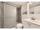 Modern bathroom with a walk-in shower, sleek vanity, and contemporary fixtures, offering a spa-like experience at 3440 Chase St, Wheat Ridge, CO 80212
