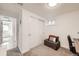 Spacious bedroom featuring a closet, natural light, and comfortable seating, perfect for relaxation and productivity at 3440 Chase St, Wheat Ridge, CO 80212