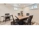 Bright dining room with a modern table and chairs, complemented by a stylish rug and ample natural light at 3440 Chase St, Wheat Ridge, CO 80212