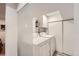 Well-lit laundry room with modern washer and dryer, plus convenient built-in storage for all your laundry needs at 3440 Chase St, Wheat Ridge, CO 80212