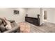 Cozy living room featuring an electric fireplace, comfortable seating, and stylish decor for a relaxing atmosphere at 3440 Chase St, Wheat Ridge, CO 80212